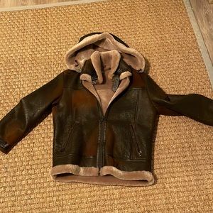 Unisex.Size small shearling bomber brand new condition..Overland. Price is firm